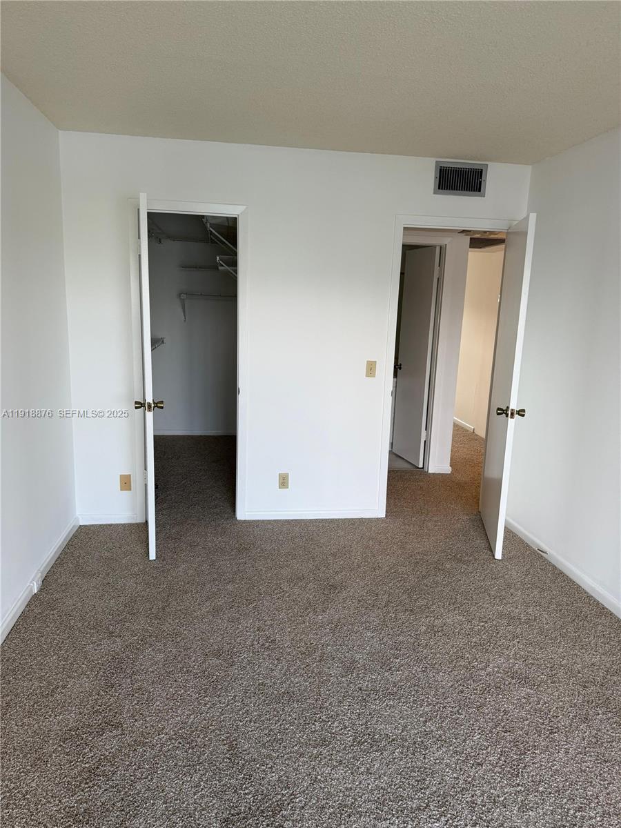 2052 Exeter C, Unit 2052 Boca Raton, FL 33434 - Photo 29 of 35 an empty room with windows