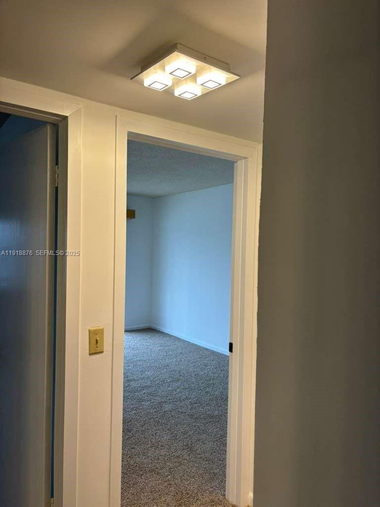 2052 Exeter C, Unit 2052 Boca Raton, FL 33434 - Photo 35 of 35 an empty room with windows