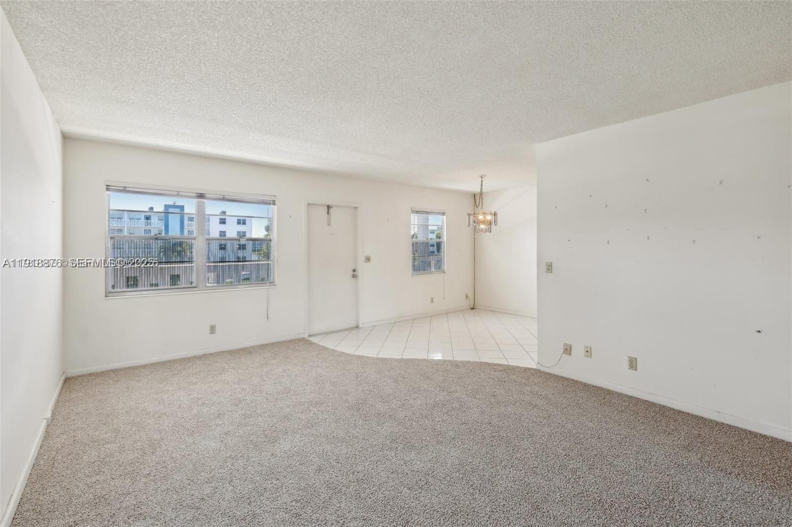 2052 Exeter C, Unit 2052 Boca Raton, FL 33434 - Photo 7 of 35 an empty room with a empty space and windows