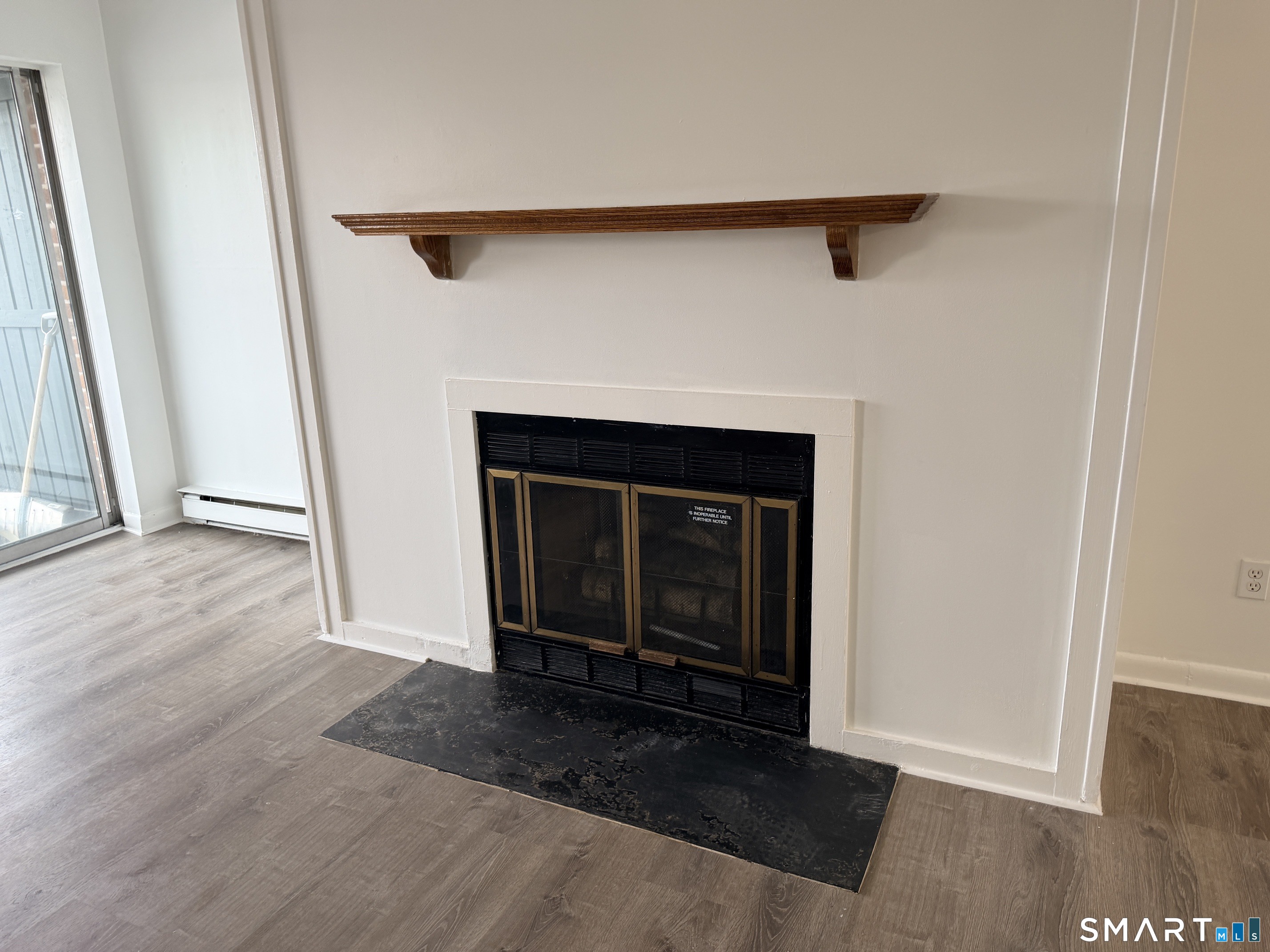 140 Kane Street, Unit C1 West Hartford, CT 06119 - Photo 6 of 11 a view of a livingroom with a fireplace