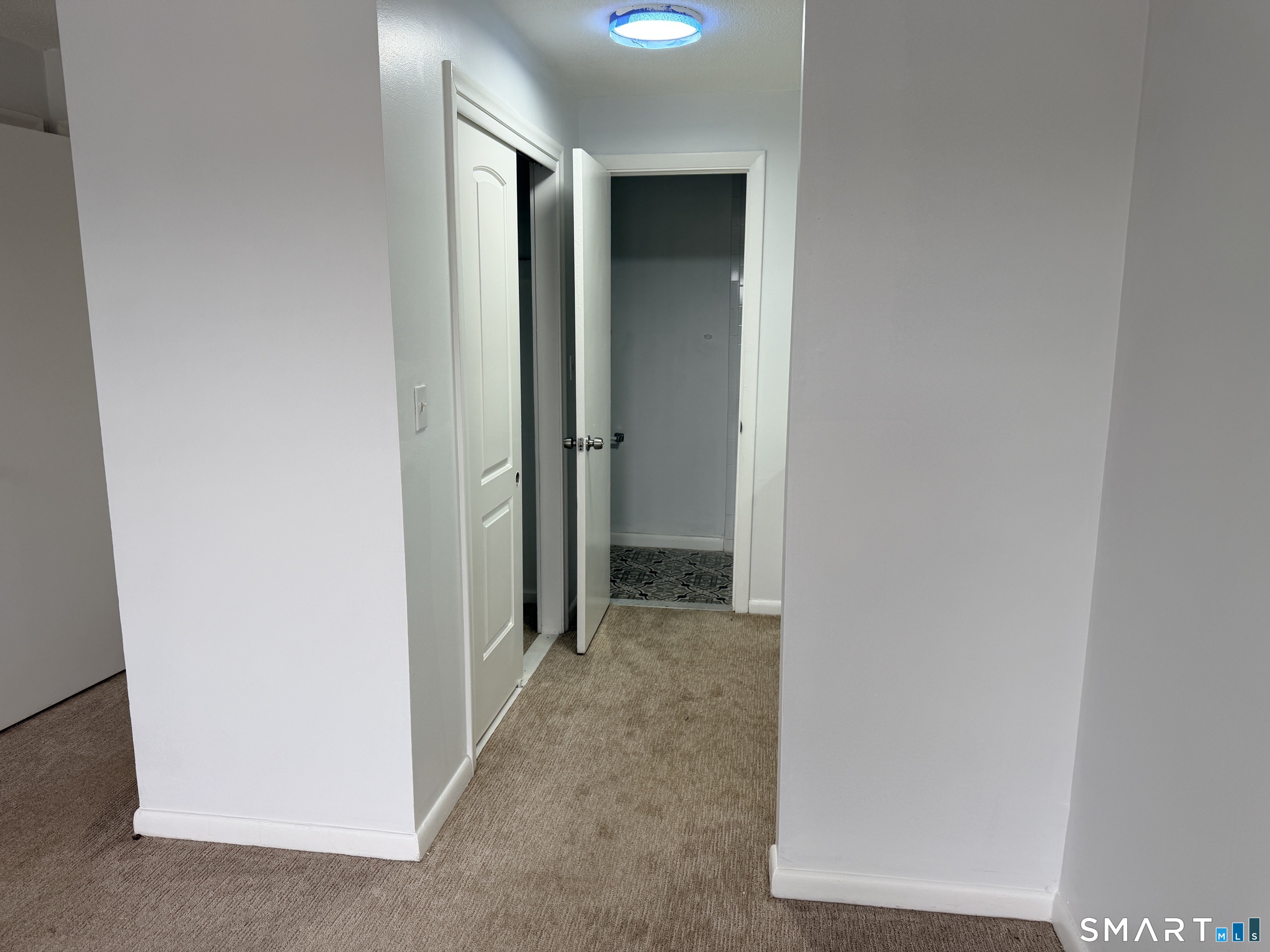 140 Kane Street, Unit C1 West Hartford, CT 06119 - Photo 8 of 11 a view of a hallway with closet