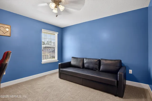 a living room with furniture and a window