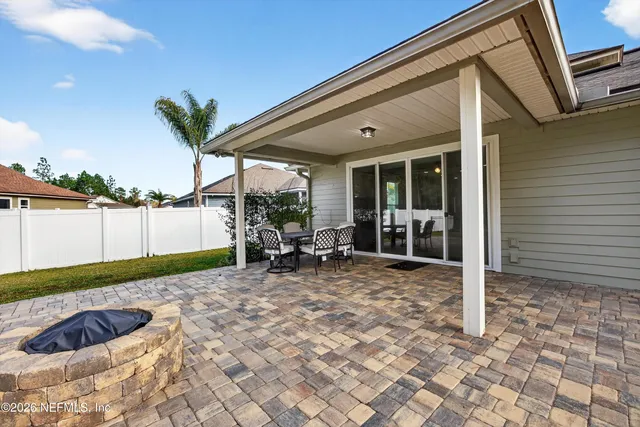 a view of a outdoor space with a patio and lake view