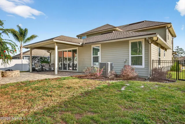 a front view of a house with a garden and porch