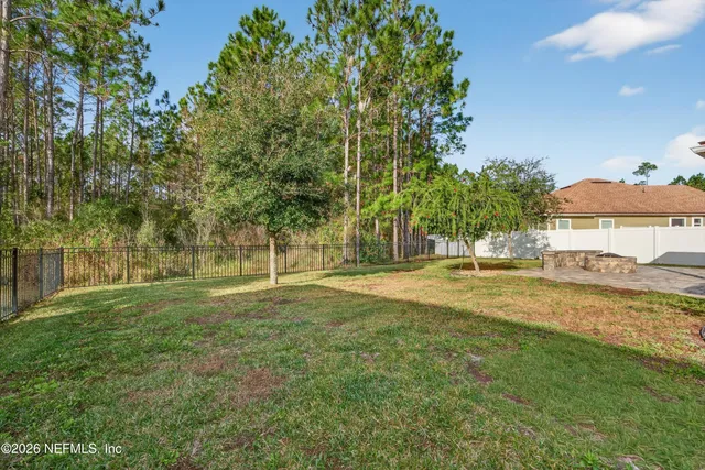 a view of backyard with green space