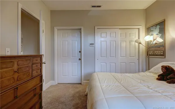 a view of a bathroom with a tub and a window