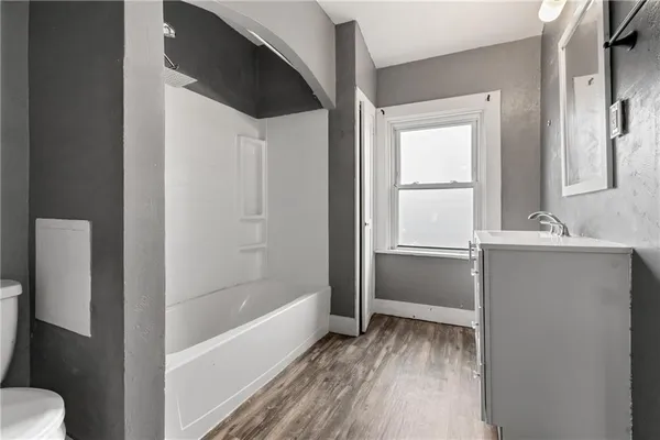 a bathroom with a sink and a bathtub