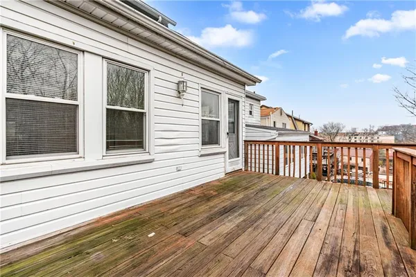 a balcony with wooden floor