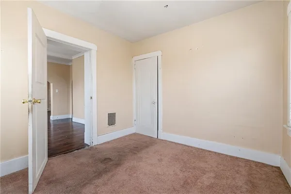 an empty room with closet