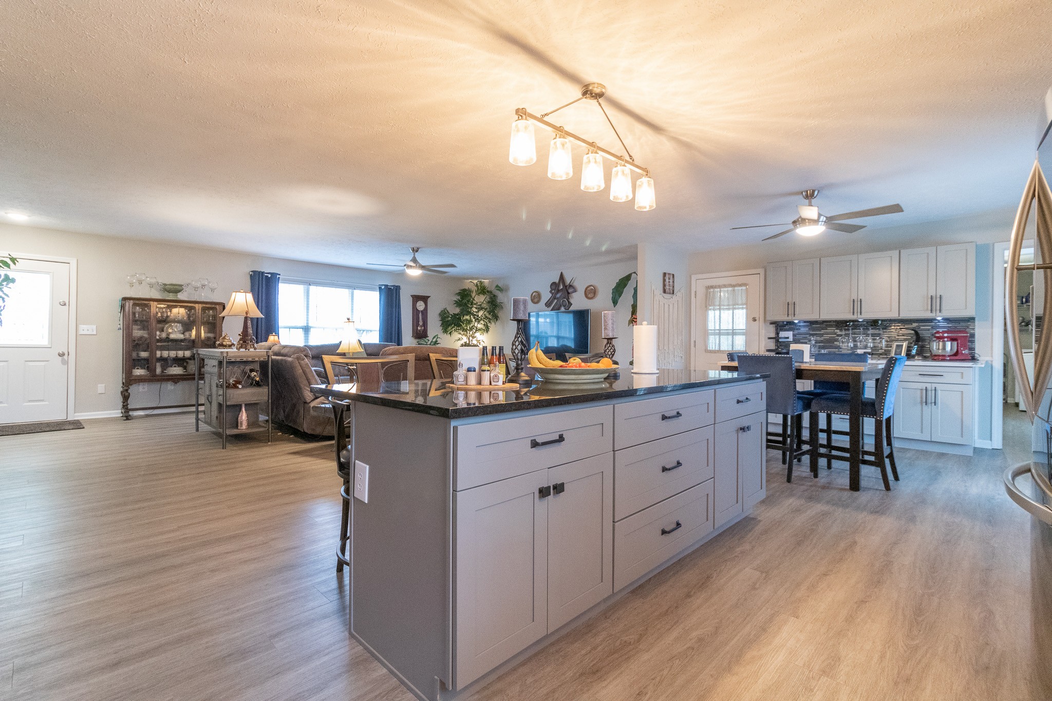 8602 Hickory Ridge Road Mount Juliet, TN 37122 - Photo 25 of 68 a kitchen with stainless steel appliances granite countertop a refrigerator a stove top oven a dining table and chairs with wooden floor