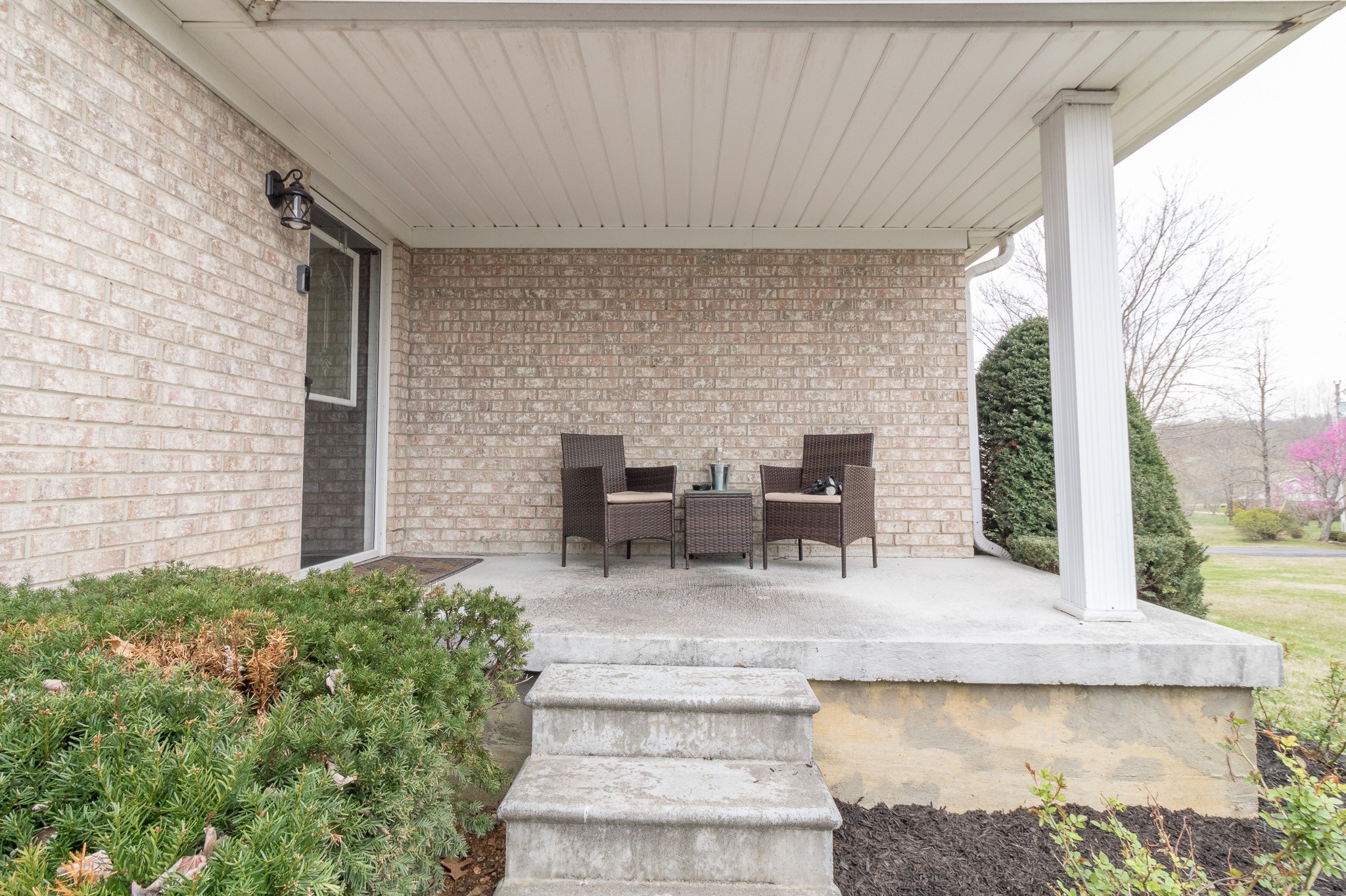 8602 Hickory Ridge Road Mount Juliet, TN 37122 - Photo 6 of 68 a view of a patio with table and chairs potted plants with floor to ceiling window and potted plants