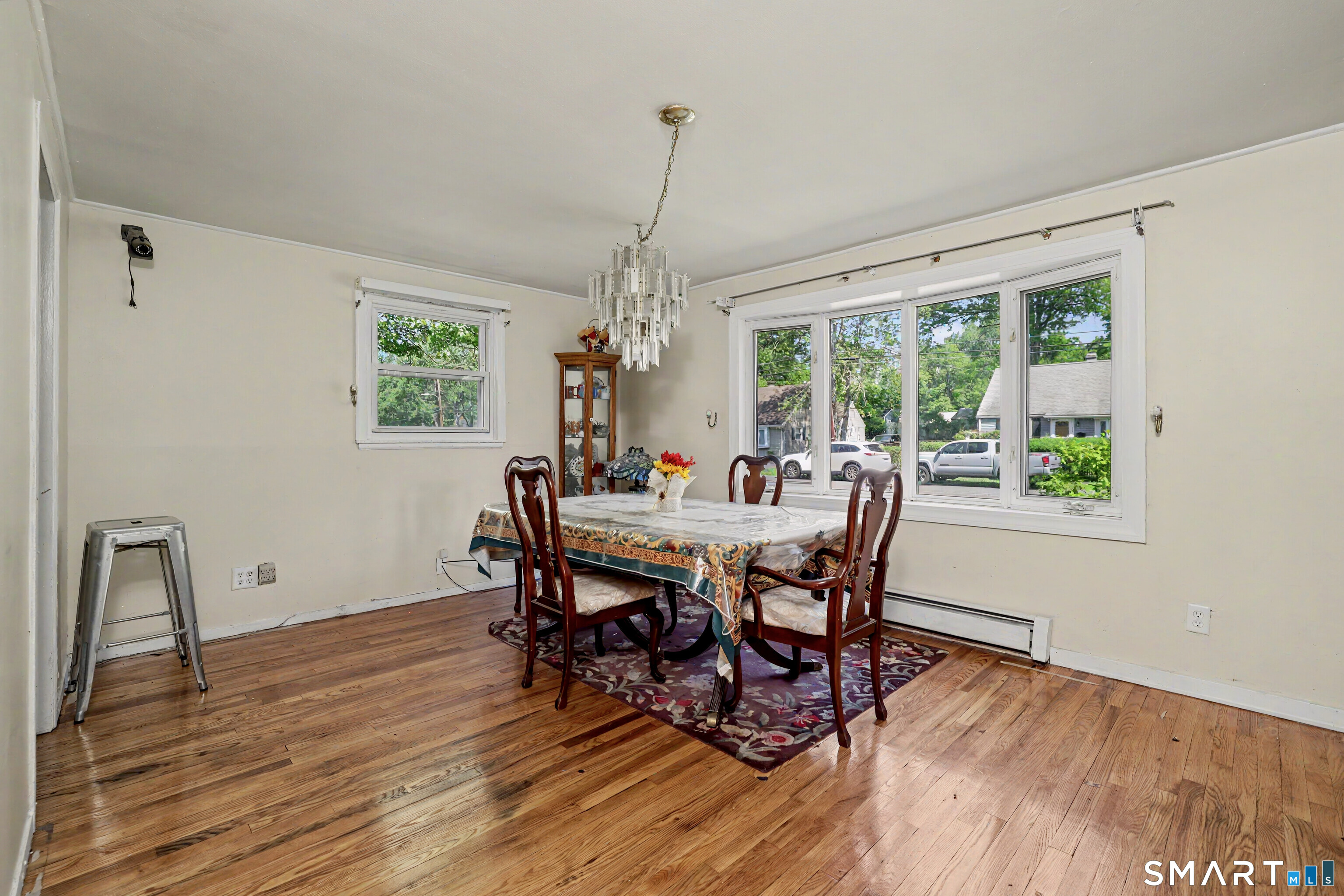 97 Boothbay Street Bloomfield, CT 06002 - Photo 11 of 33 a dining room with furniture a chandelier and wooden floor