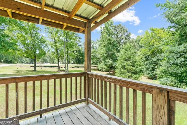 a view of a balcony with wooden floor