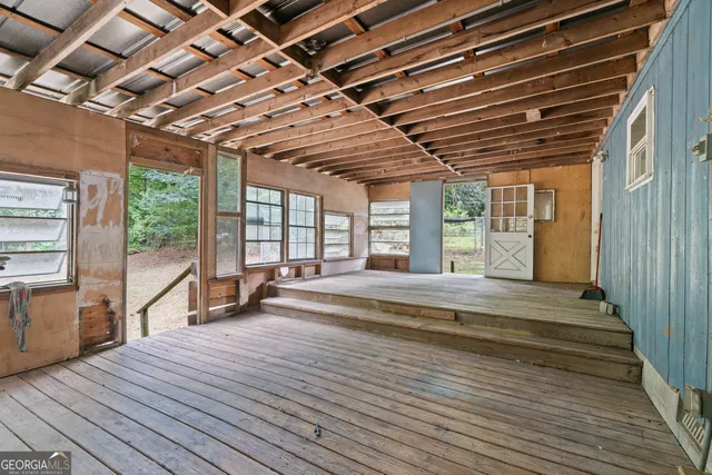 a view of a room with wooden walls