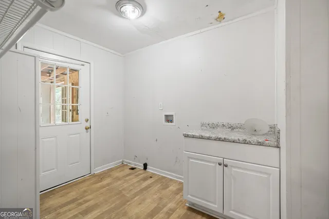 a bathroom with a granite countertop sink and vanity
