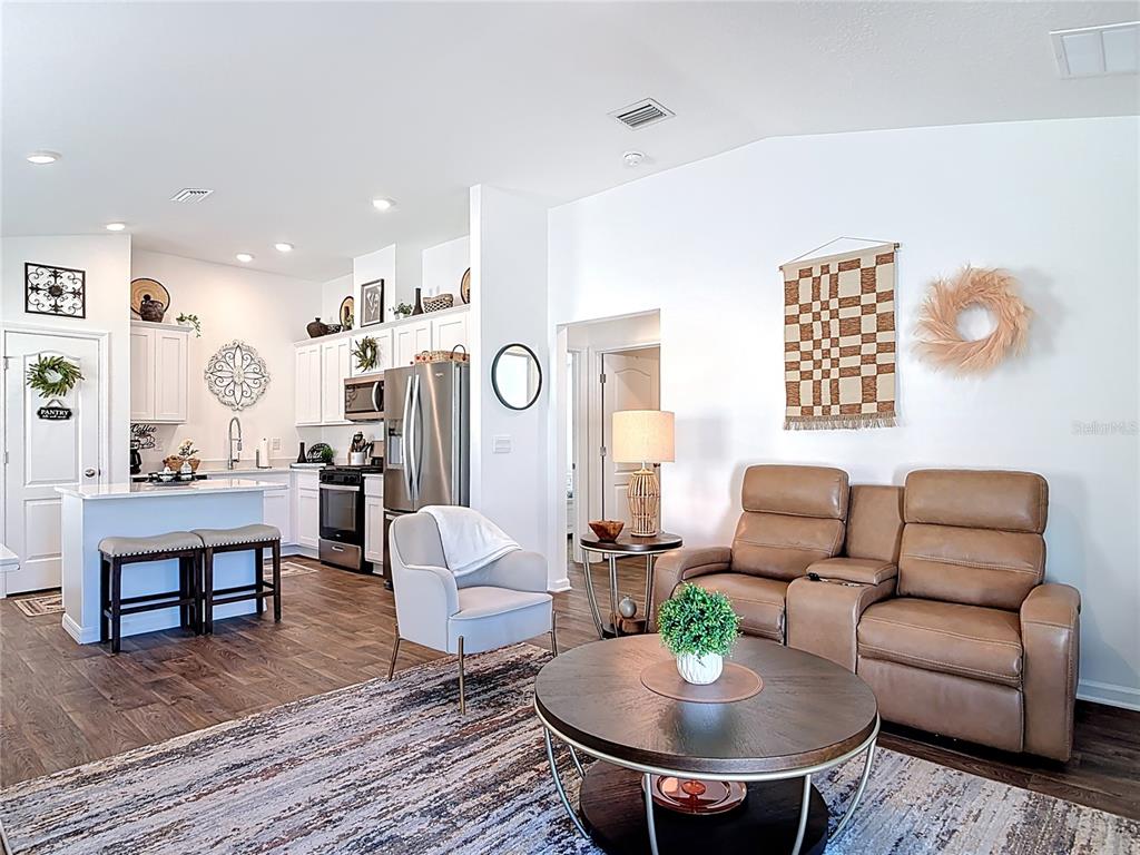 64 Bogey Place Bunnell, FL 32110 - Photo 15 of 55 a living room with furniture and a table