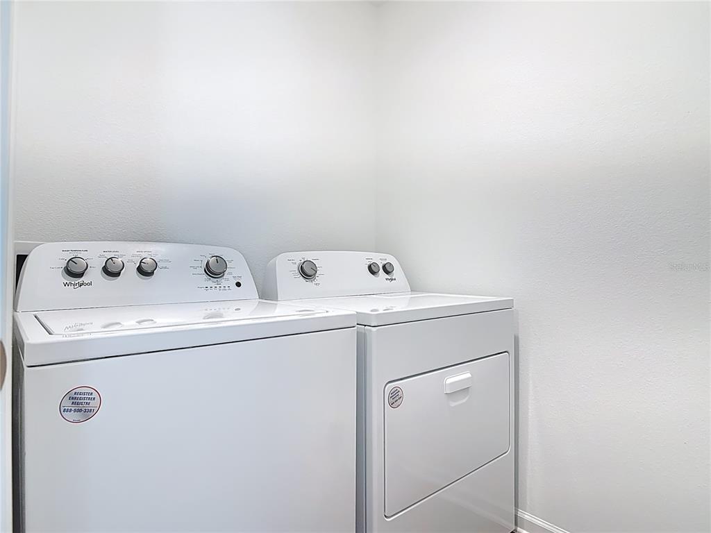 64 Bogey Place Bunnell, FL 32110 - Photo 24 of 55 a utility room with dryer and washer