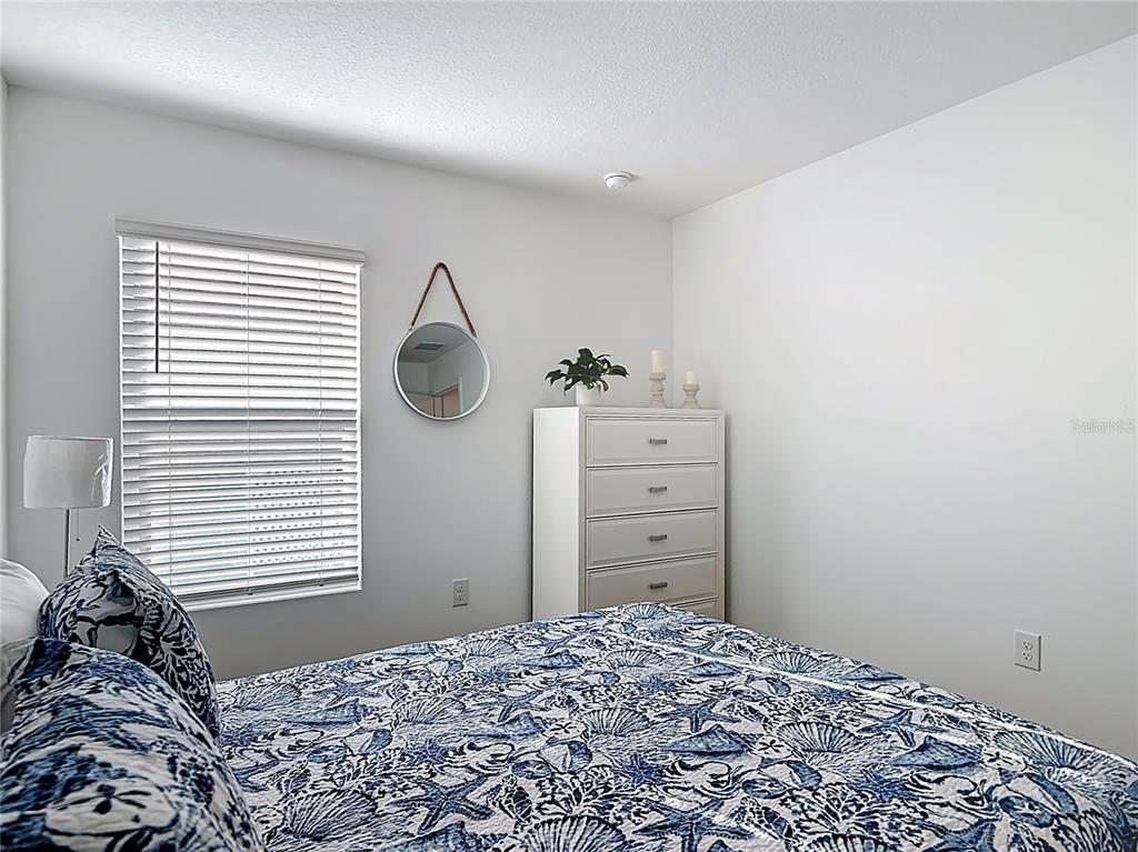 64 Bogey Place Bunnell, FL 32110 - Photo 26 of 55 a bedroom with a bed and a window