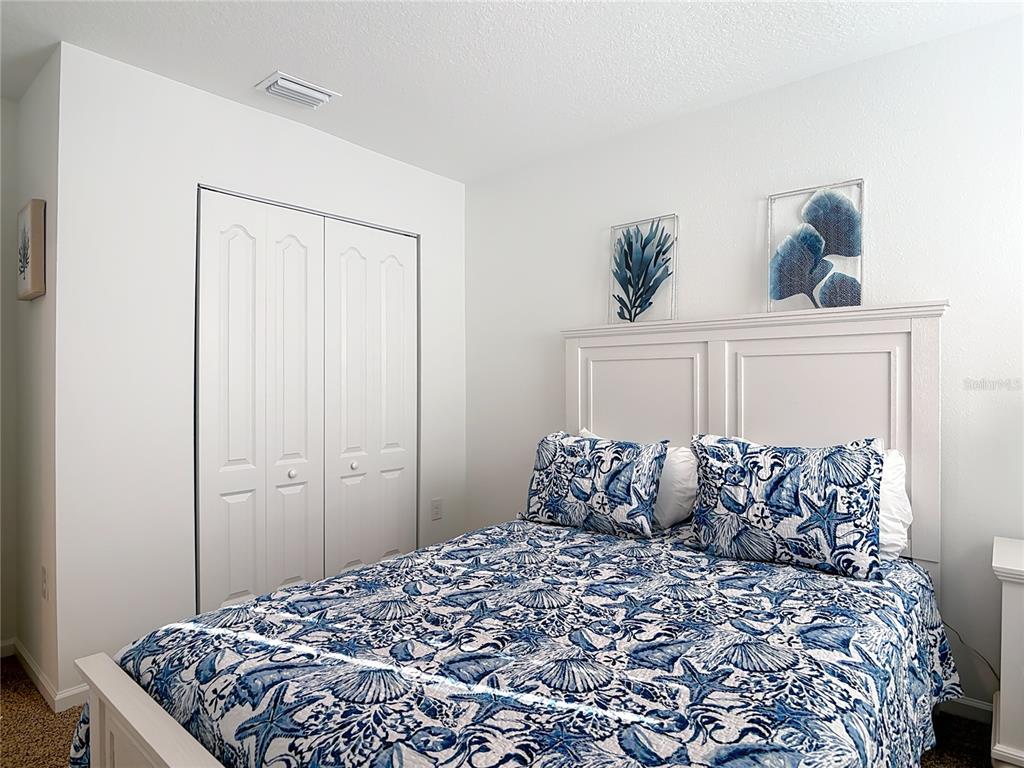 64 Bogey Place Bunnell, FL 32110 - Photo 27 of 55 a bedroom with a bed and a window