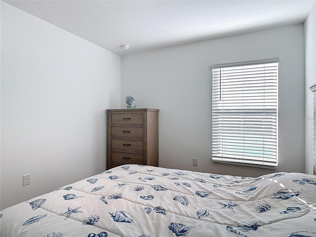 64 Bogey Place Bunnell, FL 32110 - Photo 30 of 55 a bedroom with a bed and a window