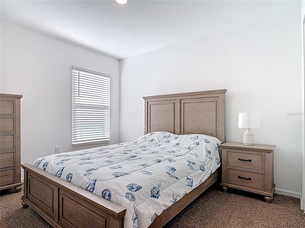 64 Bogey Place Bunnell, FL 32110 - Photo 32 of 55 a bedroom with a bed and a window