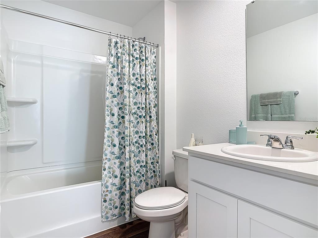 64 Bogey Place Bunnell, FL 32110 - Photo 34 of 55 a bathroom with a sink a toilet and a bathtub