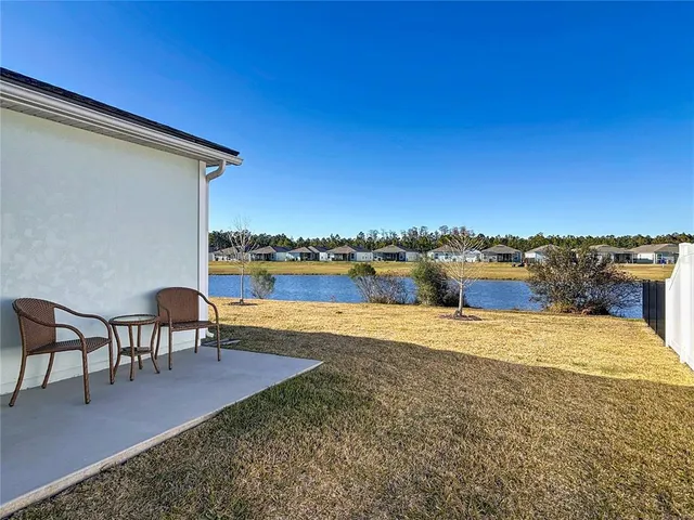 a view of a swimming pool and lounge chair