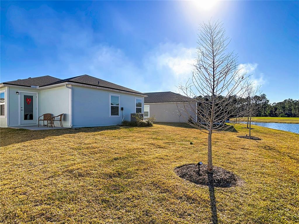 64 Bogey Place Bunnell, FL 32110 - Photo 46 of 55 a front view of a house with garden