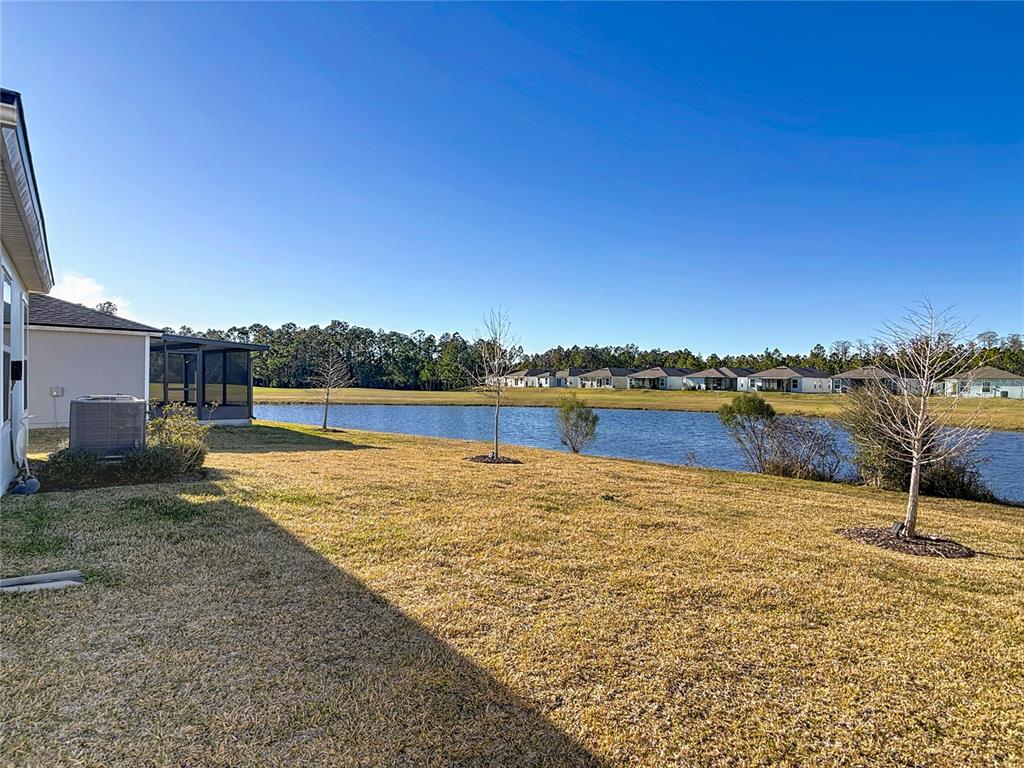 64 Bogey Place Bunnell, FL 32110 - Photo 47 of 55 a view of a lake with houses in the back