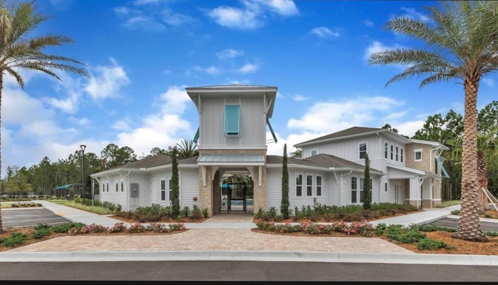 64 Bogey Place Bunnell, FL 32110 - Photo 54 of 55 a front view of a house with yard