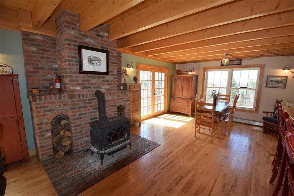 87 Sweet Road Lincoln, ME 04457 - Photo 16 of 35 Attractive brick hearth with a Jotul...