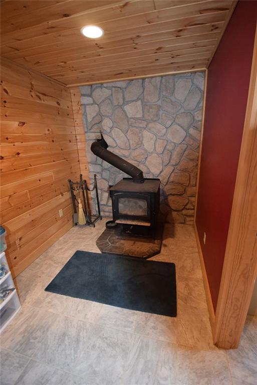 87 Sweet Road Lincoln, ME 04457 - Photo 27 of 35 Napoleon wood stove is located in...
