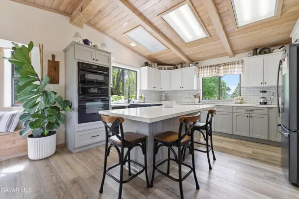 a kitchen with a table and chairs
