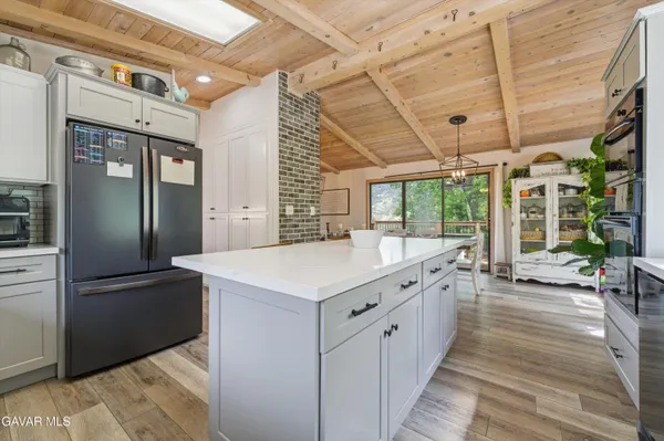 a kitchen with a stove and a refrigerator