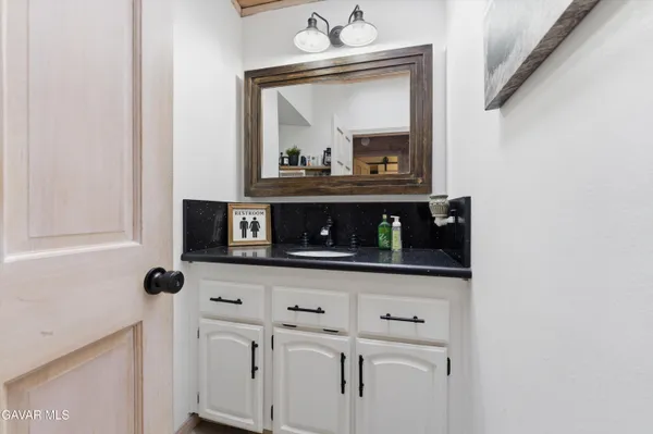 a view of microwave and sink