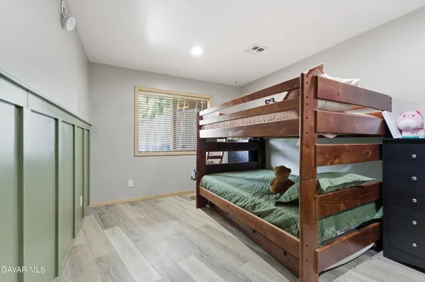 a bedroom with bed and a window