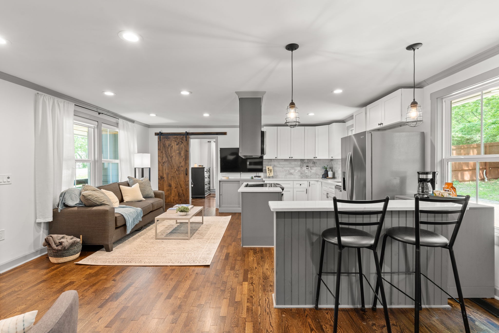 4408 Taylor Road Nashville, TN 37211 - Photo 8 of 32 a living room with stainless steel appliances kitchen island granite countertop furniture a kitchen island a stove a refrigerator a kitchen island a stove and a cabinets