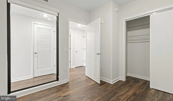 a kitchen with stainless steel appliances a stove microwave and refrigerator