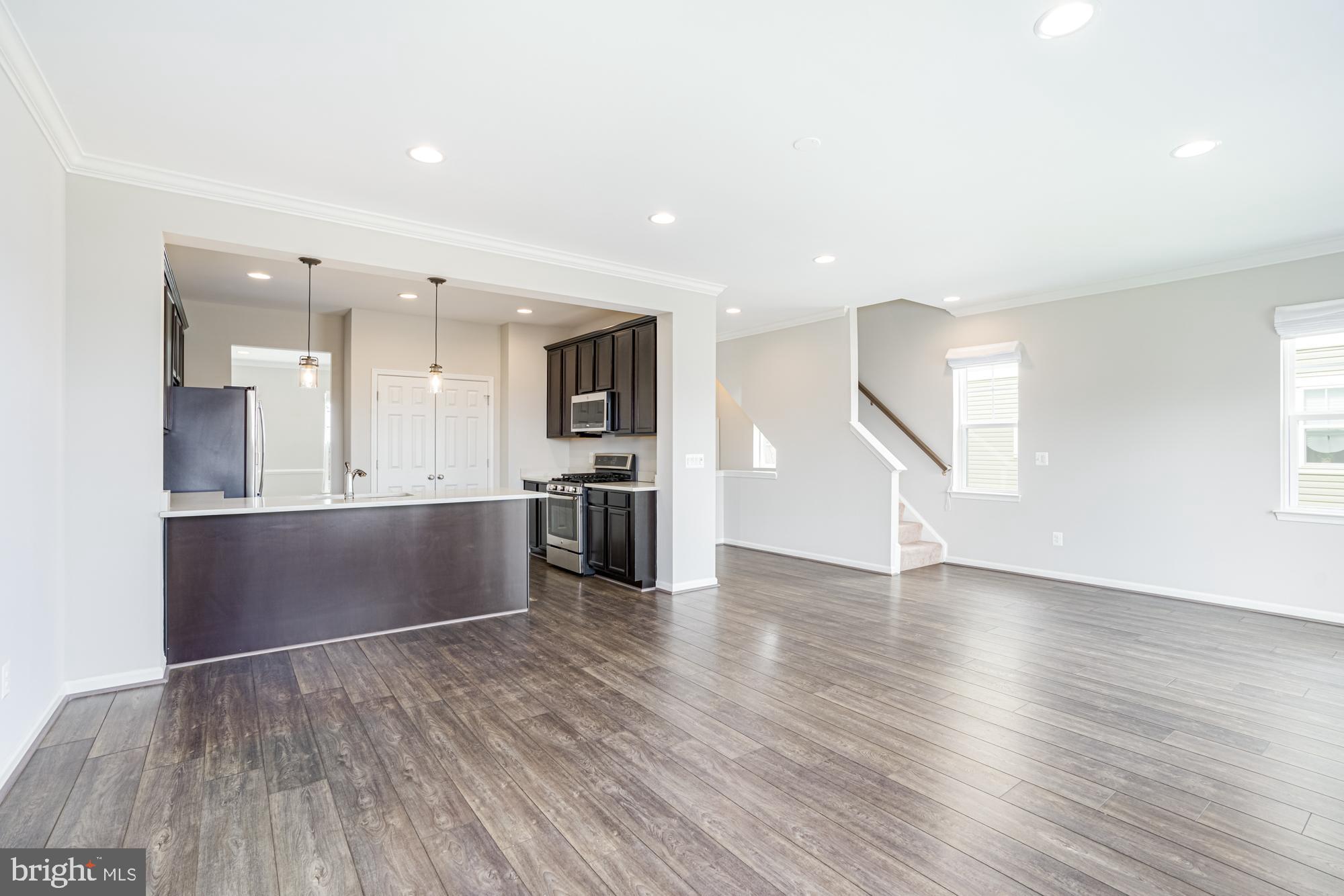 106 Splendor Garden Way Stephenson, VA 22656 - Photo 11 of 31 Spacious, modern living area with natural light.