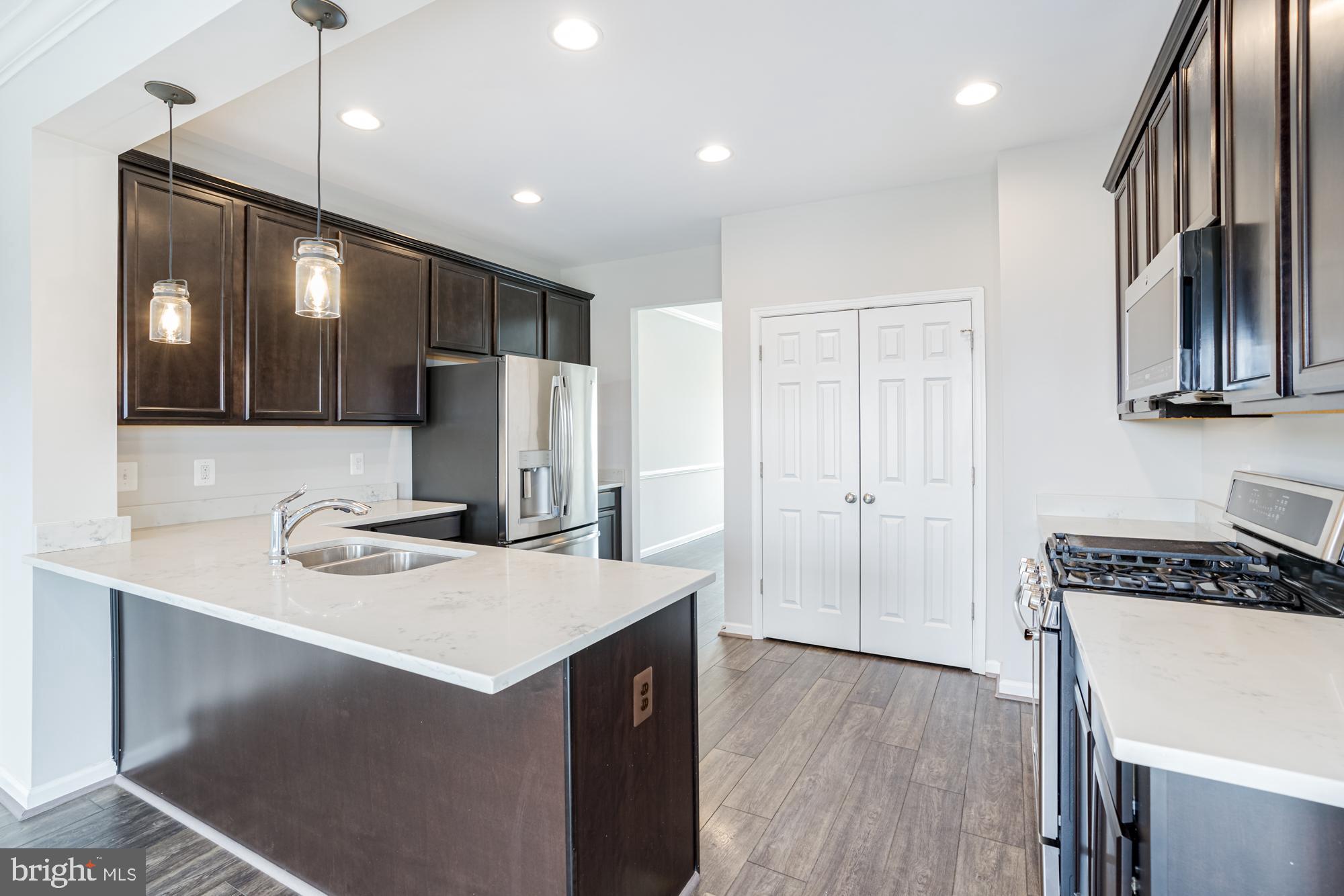 106 Splendor Garden Way Stephenson, VA 22656 - Photo 12 of 31 Modern kitchen with sleek finishes.