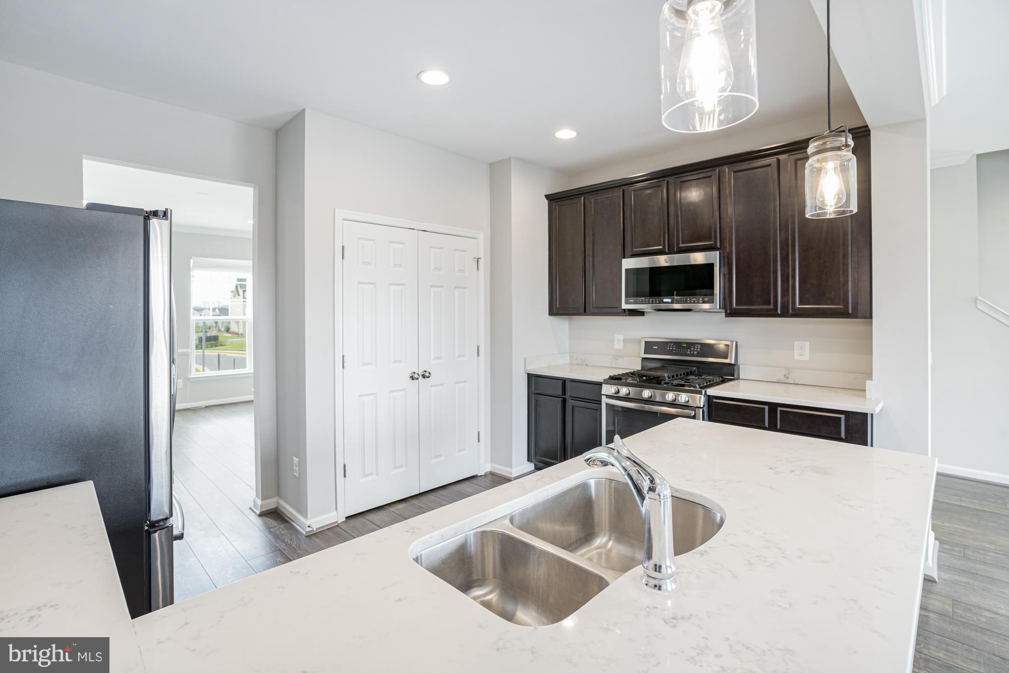 106 Splendor Garden Way Stephenson, VA 22656 - Photo 13 of 31 Modern kitchen with sleek finishes.