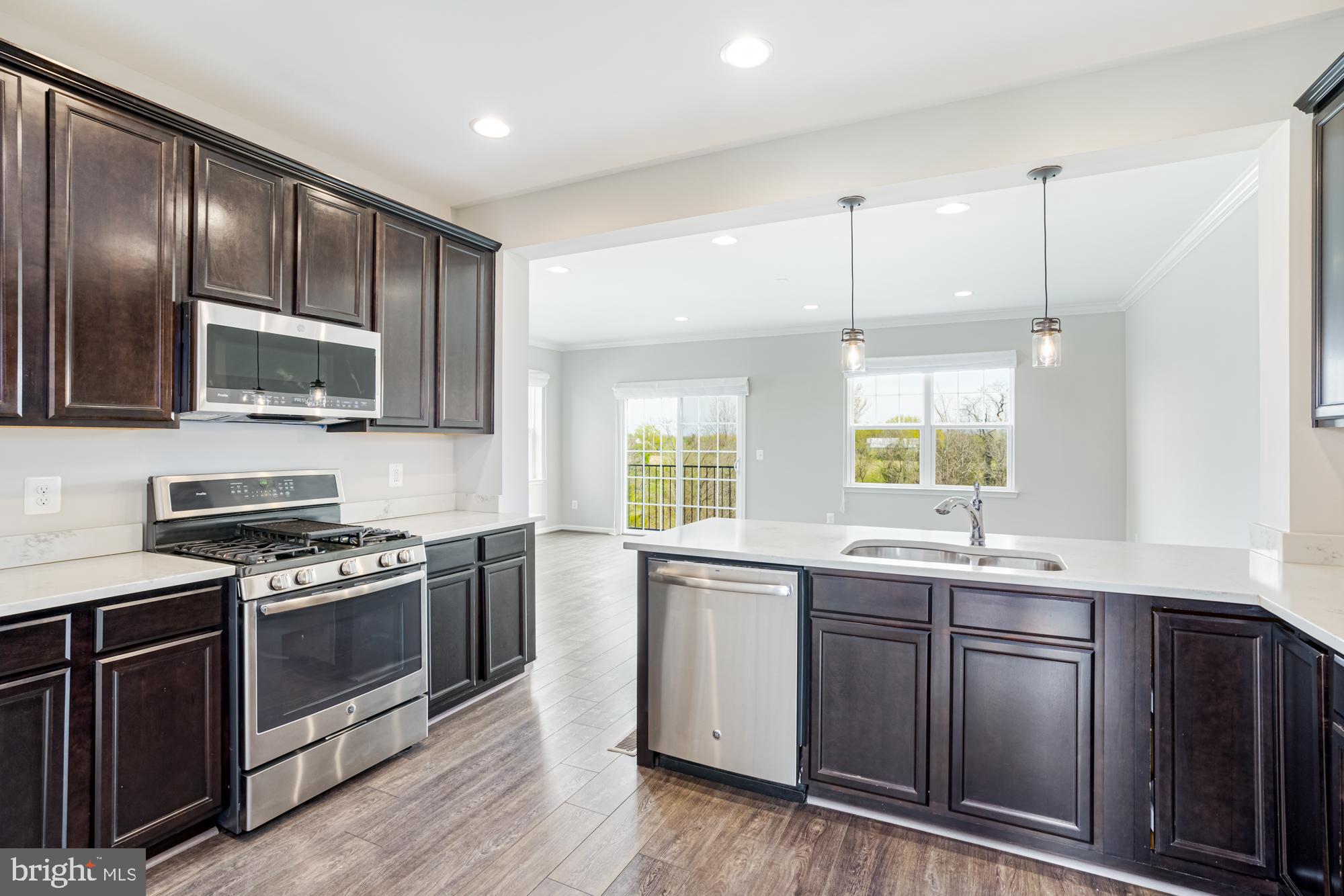 106 Splendor Garden Way Stephenson, VA 22656 - Photo 14 of 31 Modern kitchen with sleek dark cabinetry.