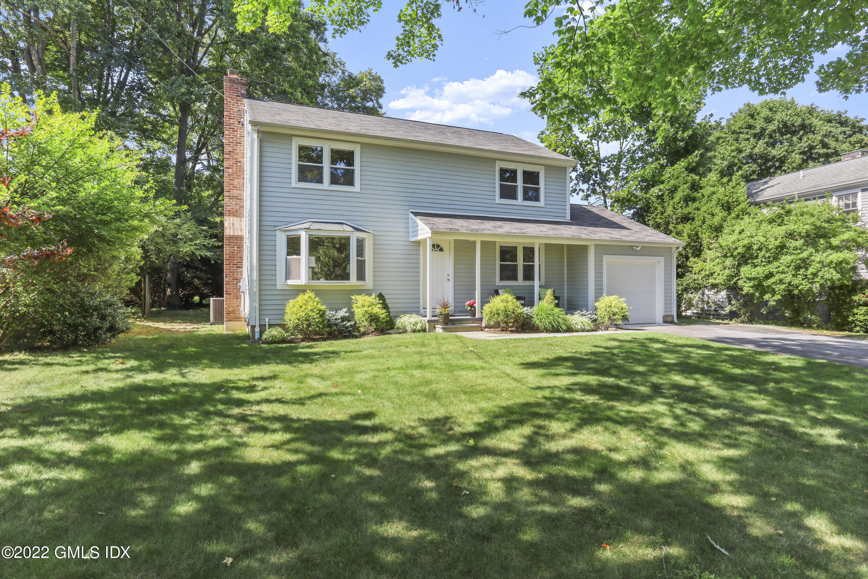 31 Lancer Road Riverside, CT 06878 - Photo 27 of 31 a front view of house with yard and green space