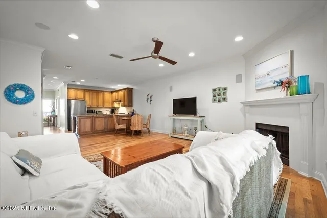 a bedroom with a large bed and a flat screen tv