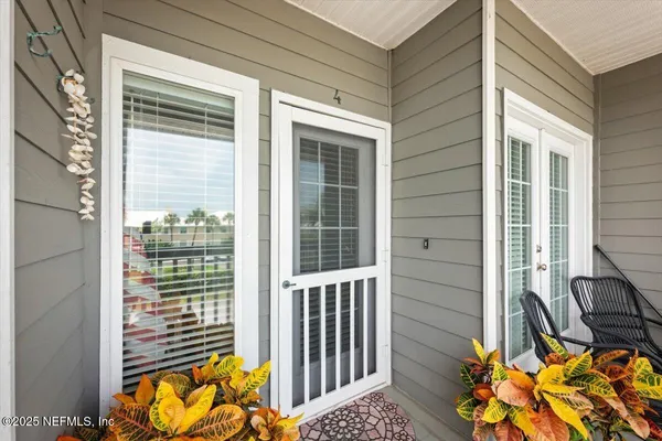 a view of a balcony with chair and the porch