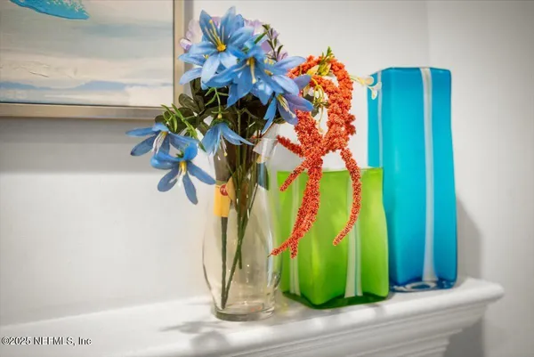 a view of a glass door with a potted plant
