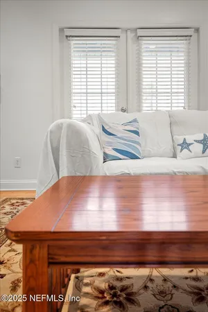 a living room with furniture and a window