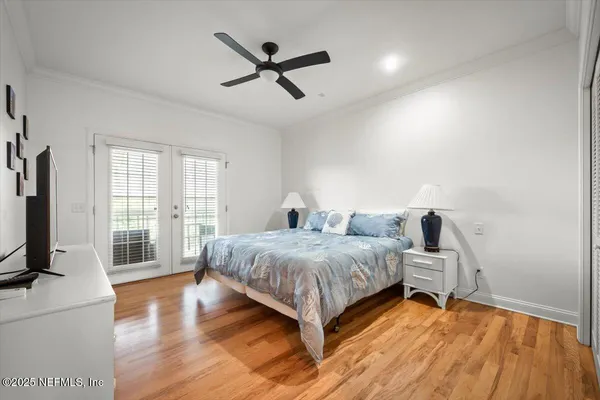 a bedroom with a bed and a table