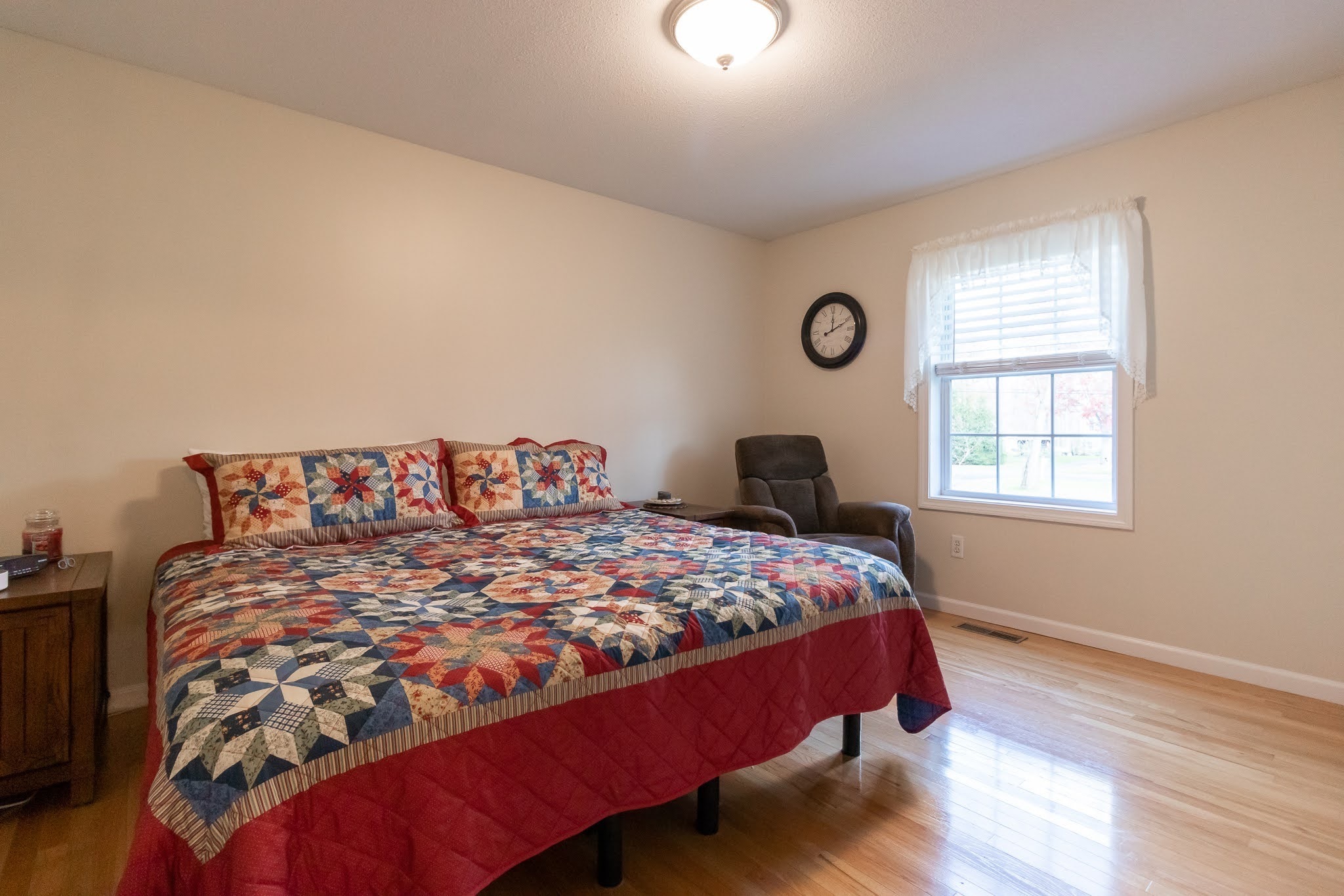 1001 Suffield Street Suffield, CT 06078 - Photo 18 of 36 a bed sitting in a bedroom next to a window