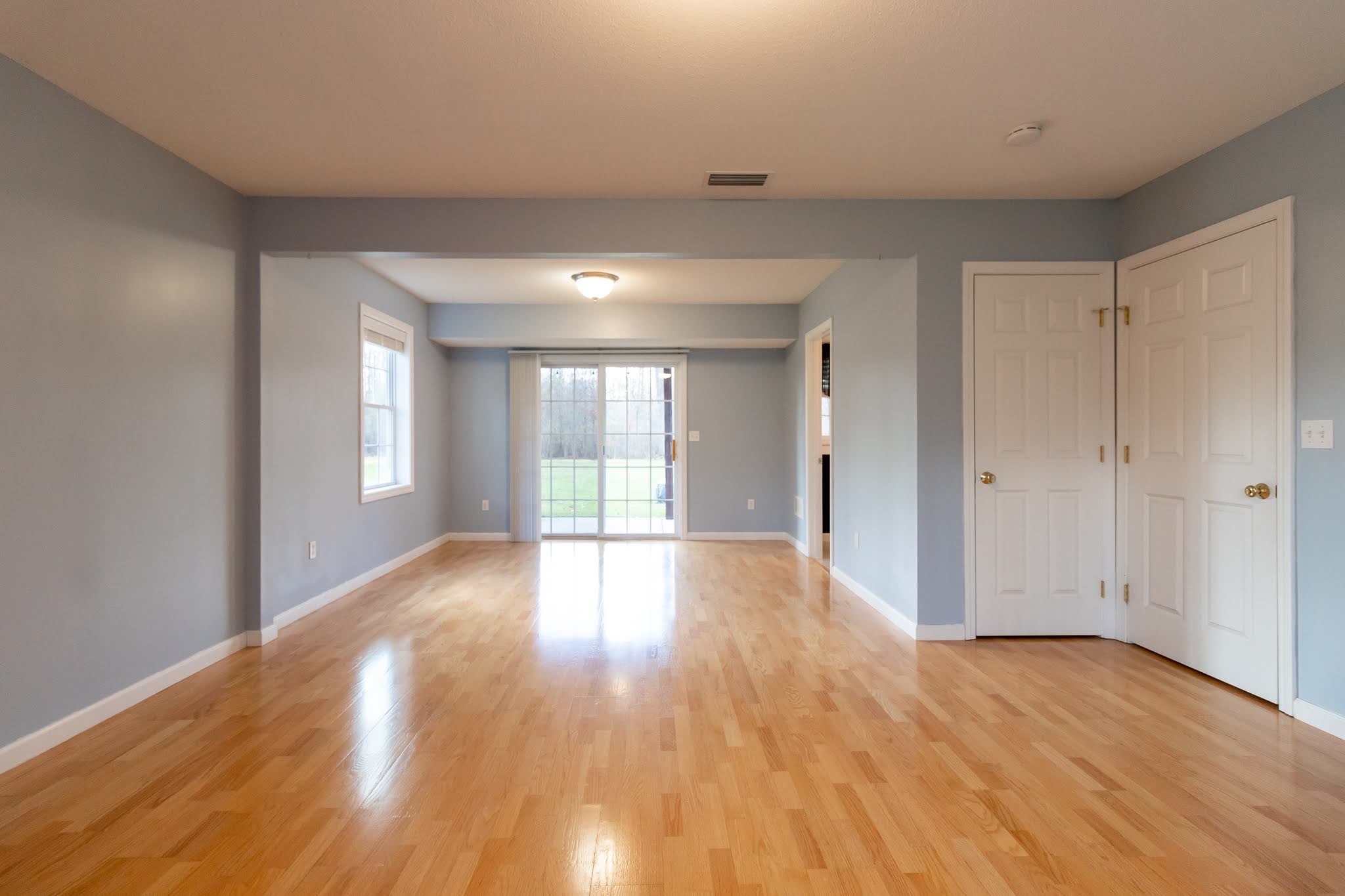 1001 Suffield Street Suffield, CT 06078 - Photo 29 of 36 a view of an empty room with wooden floor and a window